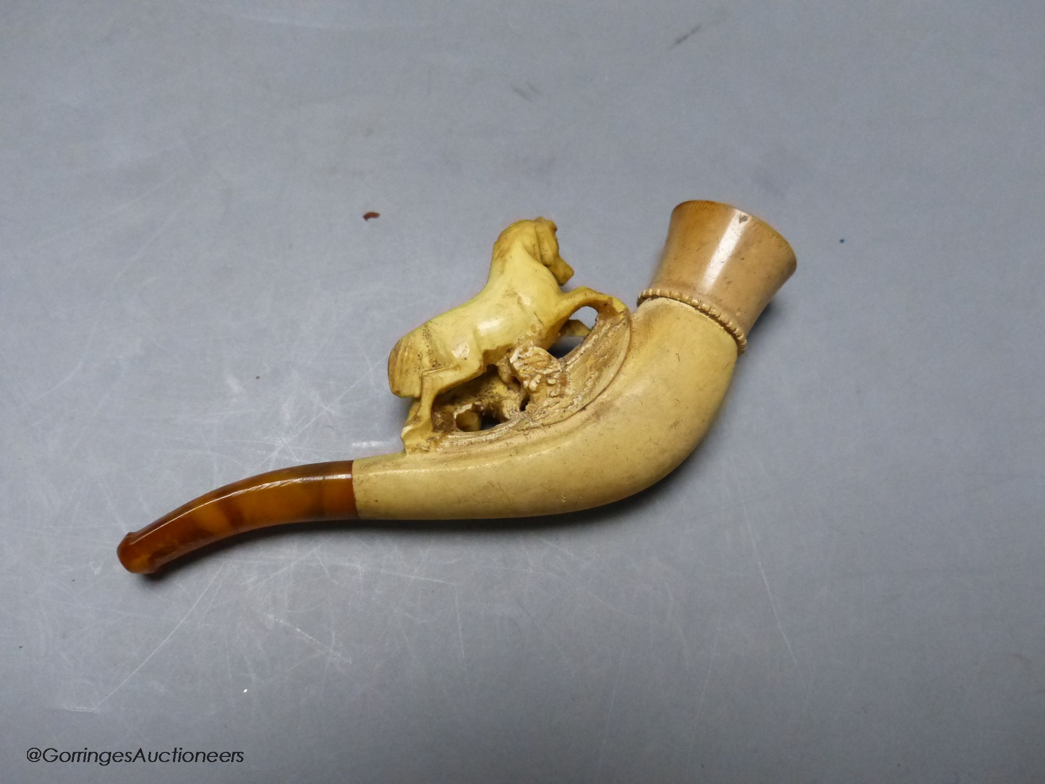 A cased meerschaum pipe